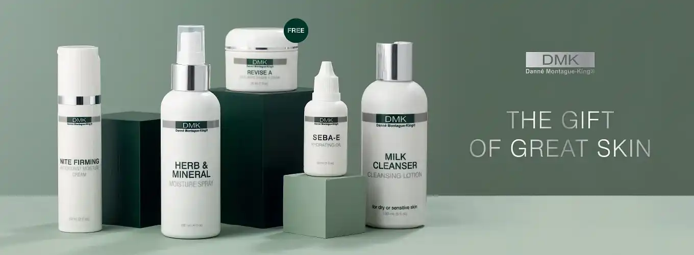 DMK skincare products display: firming cream, moisture spray, lotion, cleanser, cream.